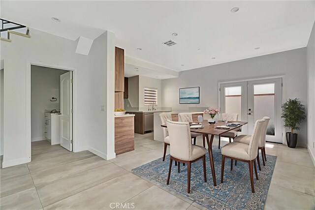 6943 Goodland Ave, North Hollywood, CA 91605 - dining space with french doors and light tile patterned flooring