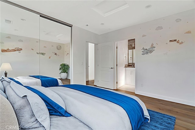6943 Goodland Ave, North Hollywood, CA 91605 - bedroom featuring wood finished floors, attic access, a closet, and ensuite bathroom