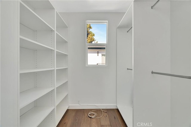 6943 Goodland Ave, North Hollywood, CA 91605 - walk in closet featuring wood finished floors
