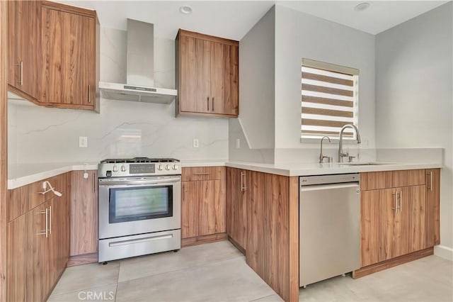 6943 Goodland Ave, North Hollywood, CA 91605 - kitchen featuring stainless steel appliances, wall chimney exhaust hood, light countertops, backsplash, and brown cabinets