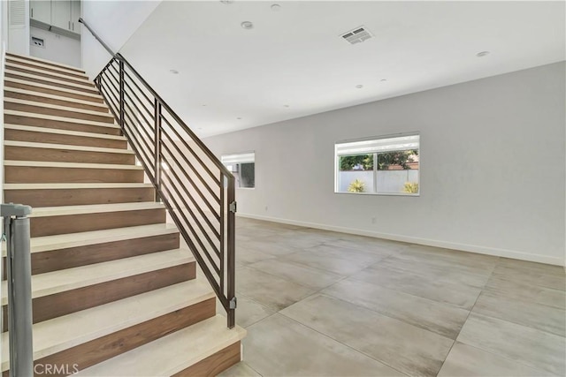 6943 Goodland Ave, North Hollywood, CA 91605 - stairway with baseboards and concrete floors