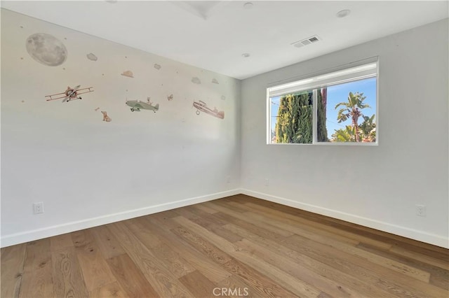 6943 Goodland Ave, North Hollywood, CA 91605 - spare room featuring baseboards and wood finished floors