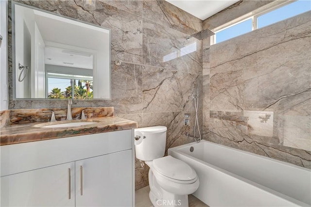 6943 Goodland Ave, North Hollywood, CA 91605 - bathroom featuring vanity, healthy amount of natural light, tile walls, and  shower combination