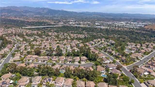 18 Via Tigra, Rancho Santa Margarita, CA 92688 - aerial view of property and surrounding area with a mountainous background and nearby suburban area