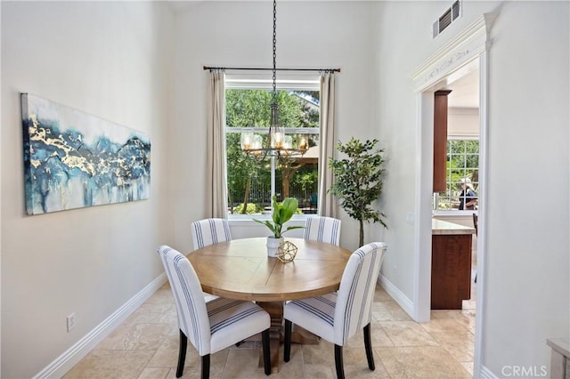 18 Via Tigra, Rancho Santa Margarita, CA 92688 - dining space featuring a chandelier and light stone finish flooring