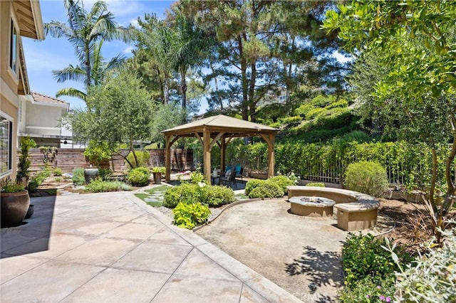 18 Via Tigra, Rancho Santa Margarita, CA 92688 - fenced backyard featuring a fire pit, a gazebo, and a patio area