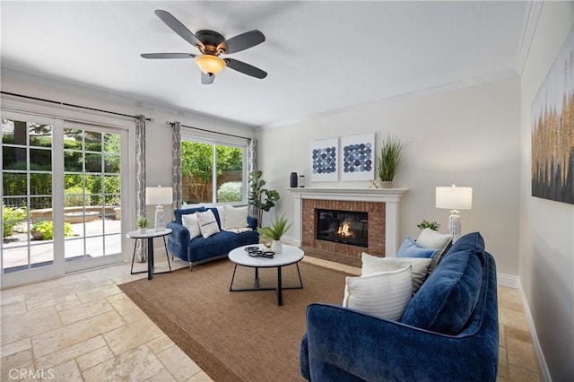 18 Via Tigra, Rancho Santa Margarita, CA 92688 - living room with stone tile floors, ornamental molding, a brick fireplace, and a ceiling fan