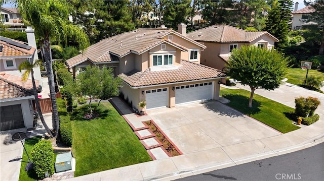 18 Via Tigra, Rancho Santa Margarita, CA 92688 - view of front of property featuring stucco siding, a tiled roof, a front yard, and concrete driveway