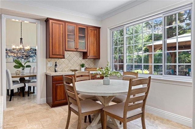 18 Via Tigra, Rancho Santa Margarita, CA 92688 - dining area with a chandelier and crown molding