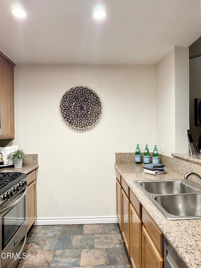 501 E Del Mar Blvd Unit 303, Pasadena, CA 91101 - kitchen featuring stainless steel appliances, dark stone finish flooring, and light stone countertops