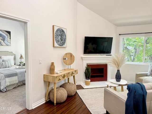 501 E Del Mar Blvd Unit 303, Pasadena, CA 91101 - living room with lofted ceiling, dark wood-style floors, and a fireplace with flush hearth