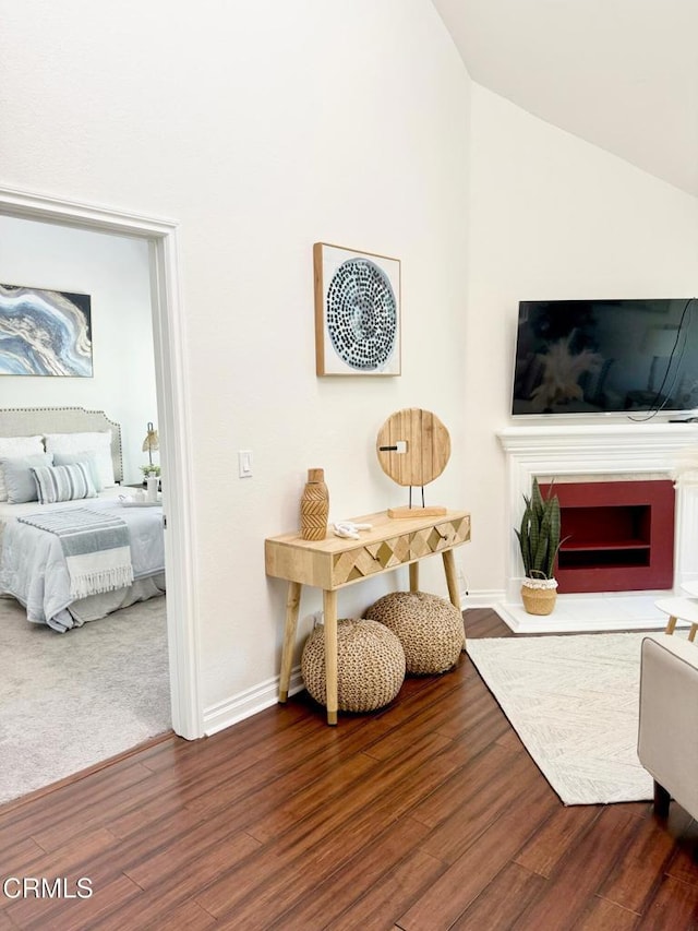 501 E Del Mar Blvd Unit 303, Pasadena, CA 91101 - living area featuring wood finished floors, lofted ceiling, and a fireplace