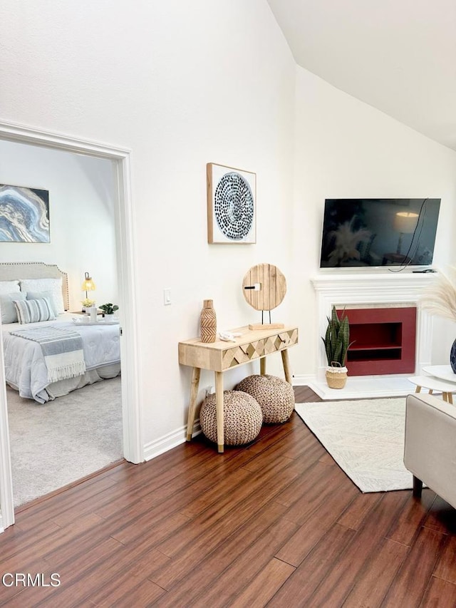 501 E Del Mar Blvd Unit 303, Pasadena, CA 91101 - living area featuring wood finished floors, lofted ceiling, and a fireplace