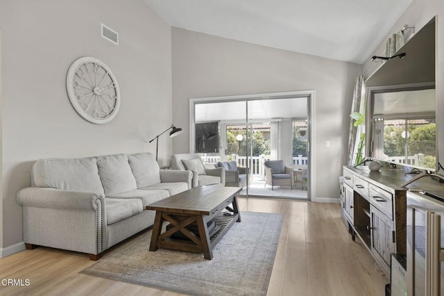 1716 Shoreline St, Camarillo, CA 93010 - living room with plenty of natural light, light wood-style flooring, high vaulted ceiling, and a chandelier