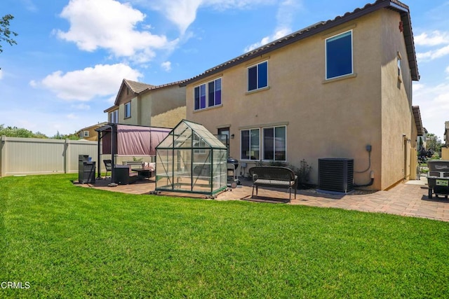 665 Tiber River Way, Oxnard, CA 93036 - back of house with a patio area, stucco siding, and a greenhouse