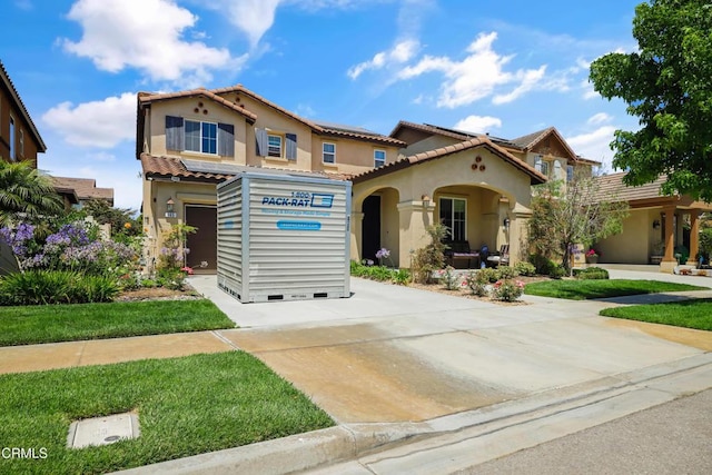 665 Tiber River Way, Oxnard, CA 93036 - mediterranean / spanish-style home with roof mounted solar panels, stucco siding, and a tiled roof