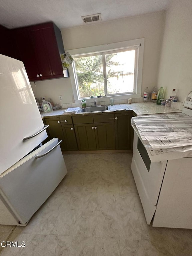752 Stewart St Unit 1/2, Fort Bragg, CA 95437 - kitchen with white appliances, tile countertops, and light flooring