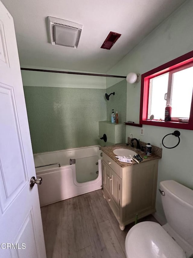 752 Stewart St Unit 1/2, Fort Bragg, CA 95437 - bathroom with bathtub / shower combination, wood finished floors, and vanity