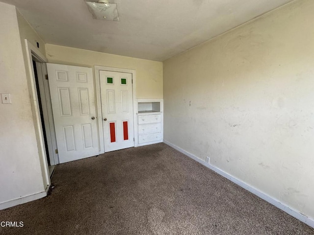 752 Stewart St Unit 1/2, Fort Bragg, CA 95437 - unfurnished bedroom with dark carpet and baseboards