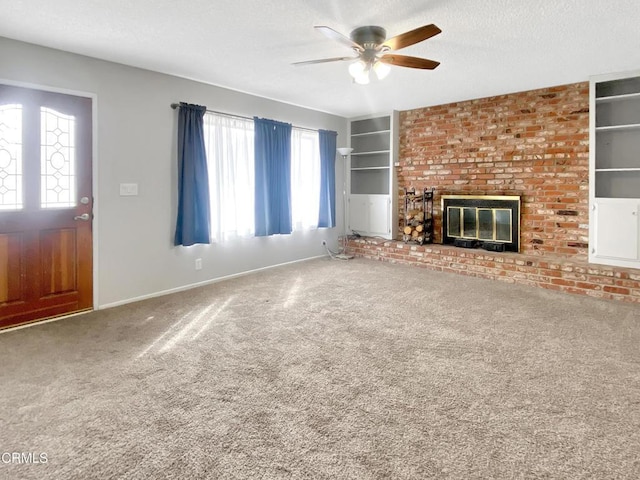 816 W Alene Ave, Ridgecrest, CA 93555 - unfurnished living room featuring a ceiling fan, carpet, a fireplace, a textured ceiling, and built in features