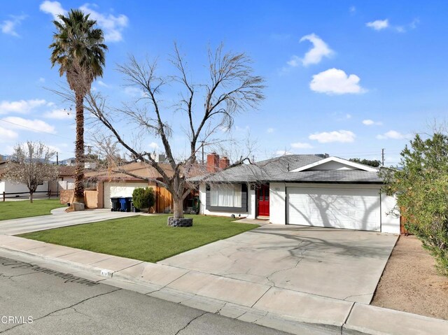 816 W Alene Ave, Ridgecrest, CA 93555 - ranch-style house featuring an attached garage, concrete driveway, a front lawn, and a chimney