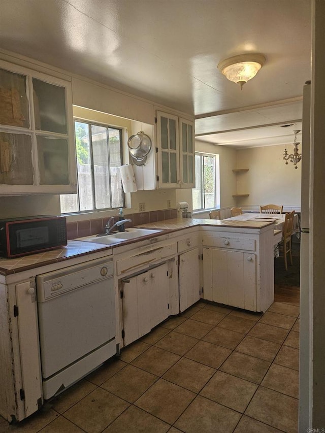 733 Cathy, Cardiff By The Sea, CA 92007 - kitchen featuring white dishwasher, black microwave, tile patterned flooring, white cabinetry, and tile countertops