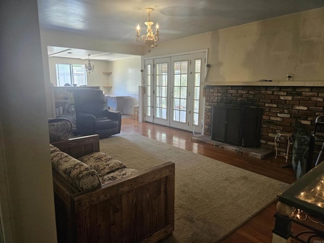 733 Cathy, Cardiff By The Sea, CA 92007 - living area featuring a chandelier, a brick fireplace, and wood finished floors