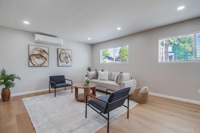 3629 Gilmore St, San Diego, CA 92113 - living room featuring a wall mounted AC, light wood-style flooring, and recessed lighting