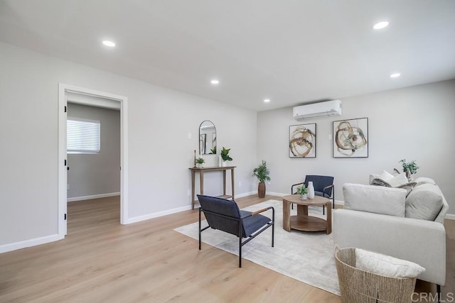3629 Gilmore St, San Diego, CA 92113 - living room with an AC wall unit, light wood-style flooring, and recessed lighting
