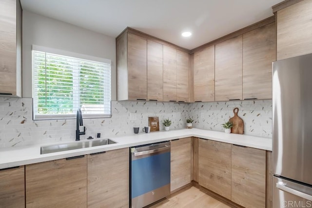 3629 Gilmore St, San Diego, CA 92113 - kitchen with dishwasher, freestanding refrigerator, backsplash, and light countertops