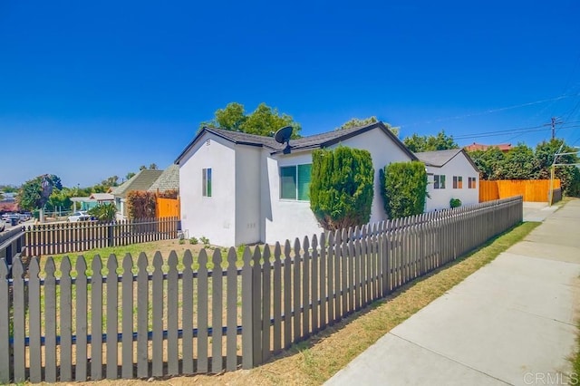 3629 Gilmore St, San Diego, CA 92113 - view of front of house with stucco siding and a fenced front yard