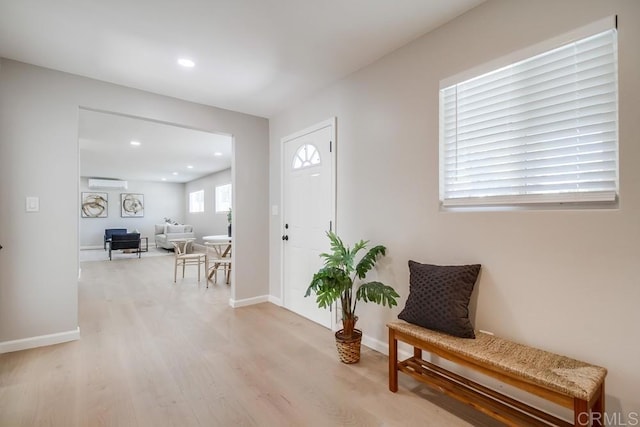 3629 Gilmore St, San Diego, CA 92113 - foyer entrance with light wood-style floors, a wall mounted air conditioner, and recessed lighting