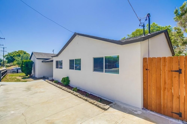 3629 Gilmore St, San Diego, CA 92113 - view of side of property with a patio and stucco siding