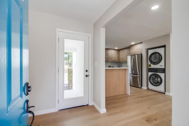 3629 Gilmore St, San Diego, CA 92113 - entryway with stacked washer and clothes dryer, light wood-style flooring, and recessed lighting