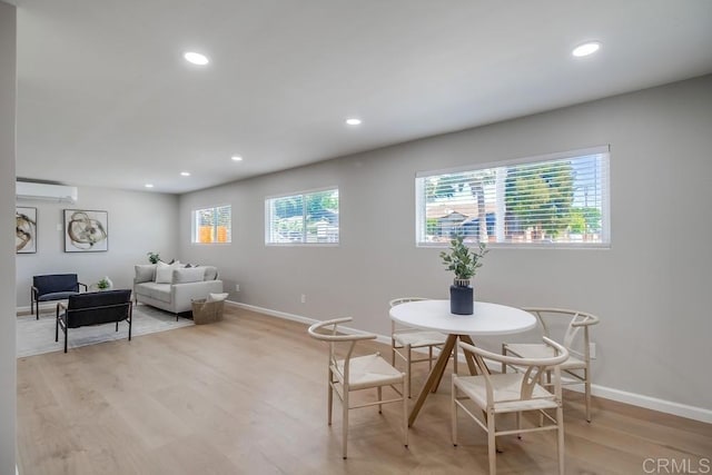 3629 Gilmore St, San Diego, CA 92113 - dining room featuring a wall mounted AC, light wood-type flooring, and recessed lighting