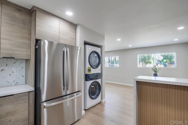 3629 Gilmore St, San Diego, CA 92113 - kitchen with freestanding refrigerator, stacked washer and clothes dryer, light wood finished floors, modern cabinets, and recessed lighting