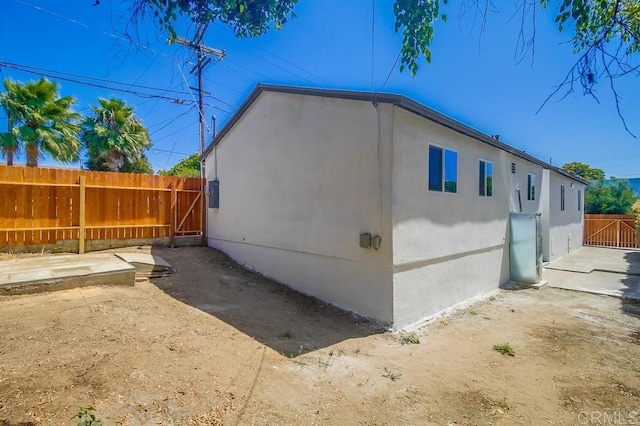 3629 Gilmore St, San Diego, CA 92113 - view of side of home featuring stucco siding