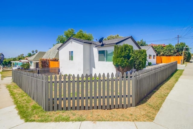3629 Gilmore St, San Diego, CA 92113 - view of front of property with stucco siding and a fenced front yard