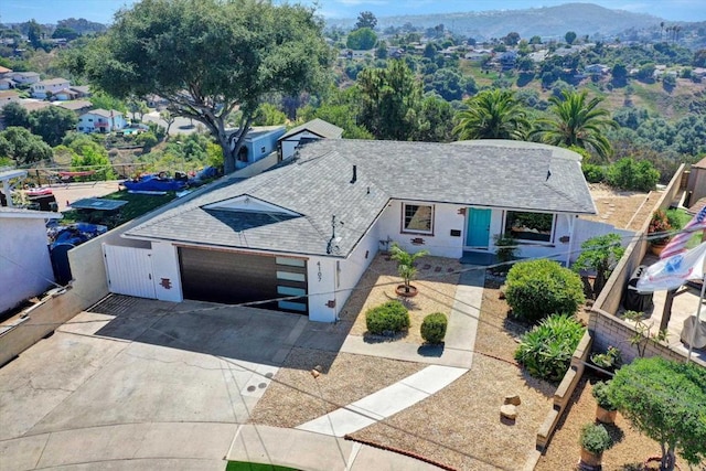 4107 Cole Way, San Diego, CA 92117 - view of front of house with a shingled roof, concrete driveway, stucco siding, and an attached garage