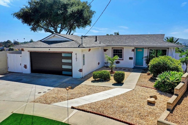 4107 Cole Way, San Diego, CA 92117 - ranch-style house with an attached garage, driveway, roof with shingles, and stucco siding