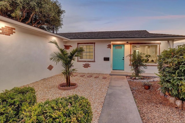4107 Cole Way, San Diego, CA 92117 - view of exterior entry featuring stucco siding and a shingled roof