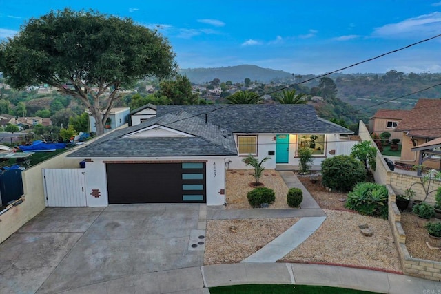 4107 Cole Way, San Diego, CA 92117 - view of front of property featuring stucco siding, roof with shingles, a gate, and a garage