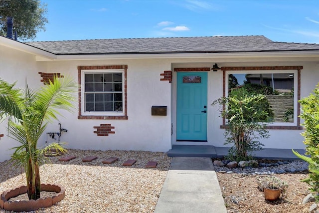 4107 Cole Way, San Diego, CA 92117 - view of exterior entry with stucco siding and roof with shingles