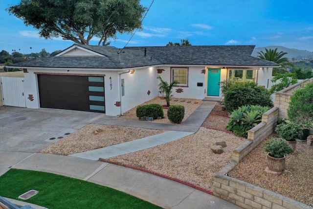 4107 Cole Way, San Diego, CA 92117 - view of front of property featuring stucco siding, an attached garage, concrete driveway, and a shingled roof