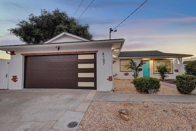 4107 Cole Way, San Diego, CA 92117 - ranch-style house with concrete driveway, a garage, and stucco siding