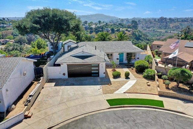 4107 Cole Way, San Diego, CA 92117 - view of front of property with concrete driveway, a garage, a gate, roof with shingles, and a mountain view