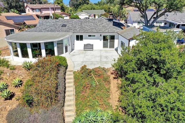 4107 Cole Way, San Diego, CA 92117 - rear view of house featuring a sunroom, a shingled roof, a patio area, a residential view, and stucco siding