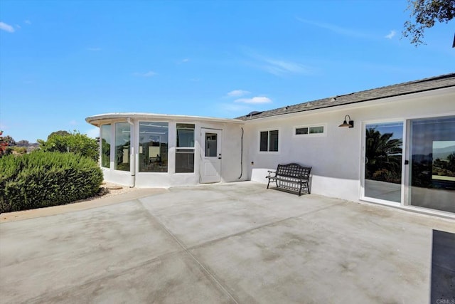 4107 Cole Way, San Diego, CA 92117 - back of property with stucco siding, a patio area, and a sunroom