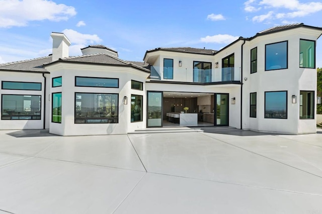 9355 Lavell St, La Mesa, CA 91941 - rear view of house featuring stucco siding and a balcony