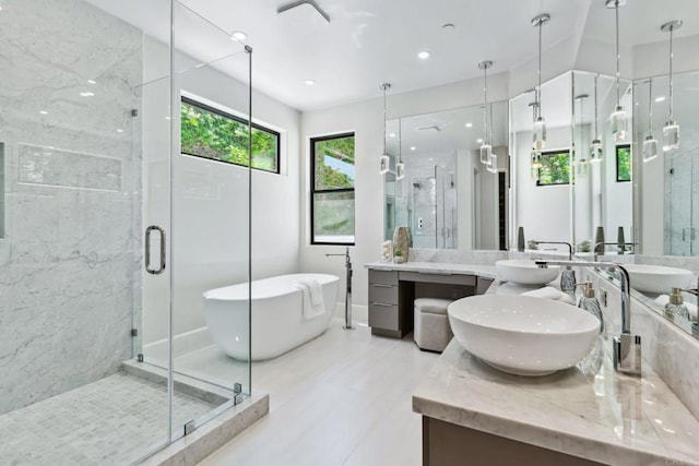 9355 Lavell St, La Mesa, CA 91941 - bathroom featuring double vanity, a freestanding bath, a shower stall, and recessed lighting